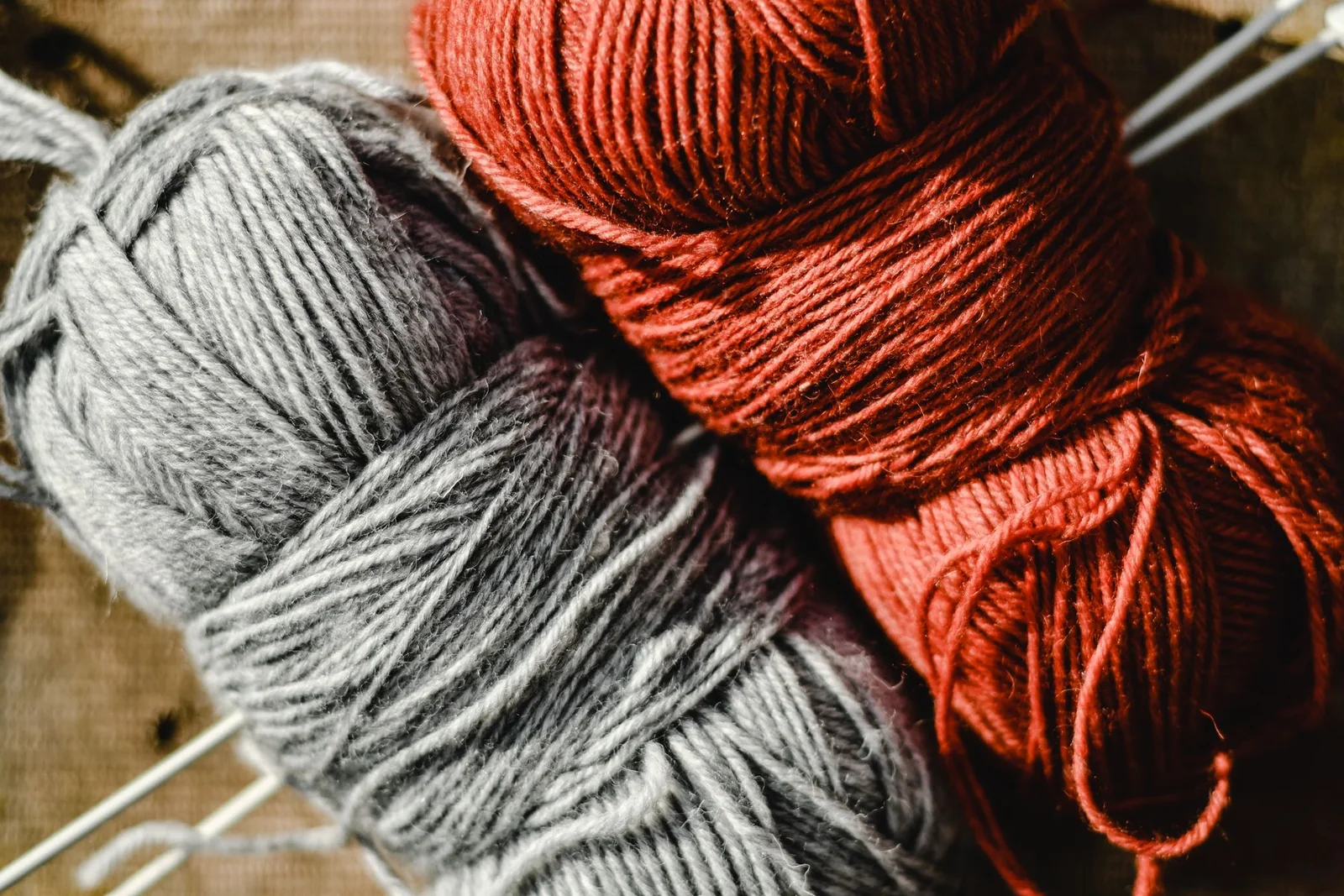 Close-up of red and gray yarn showing fiber texture