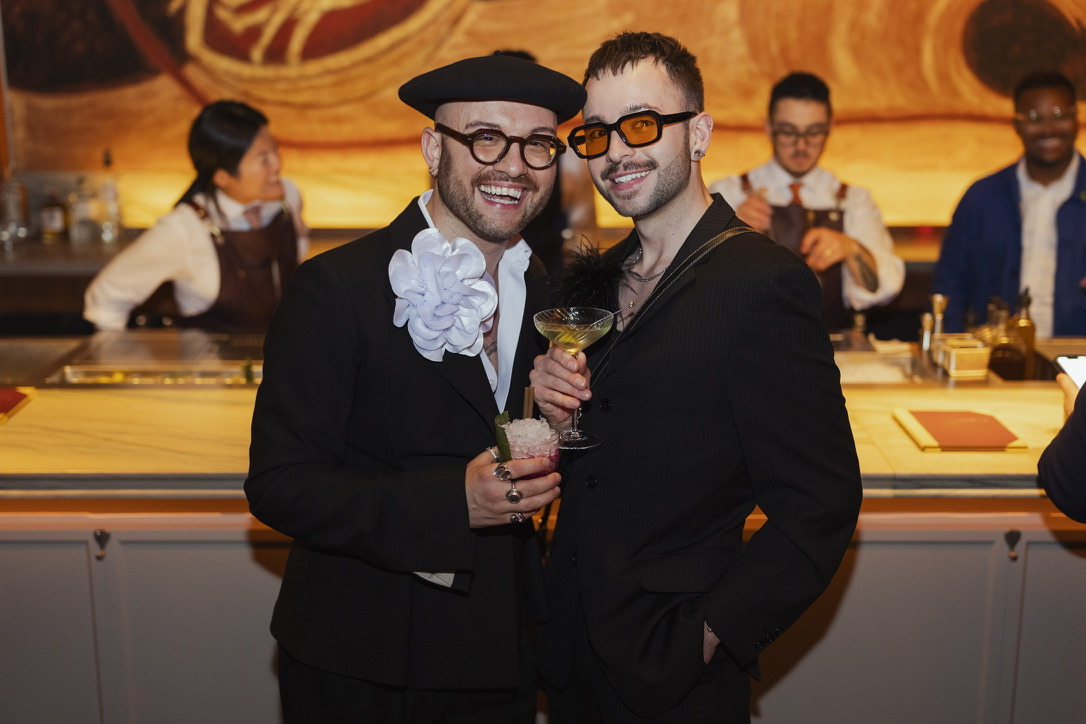 Mazen Eshak and Vincent Dale standing together at a warmly lit bar.